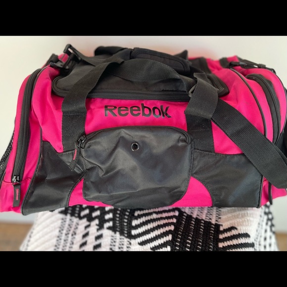 Reebok Handbags - Pink Reebok nylon training/gym bag. Measurements 9x18.5x9  Lots of pockets.